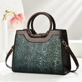 Vintage brown tote bag with green floral relief and circular top handles - Green