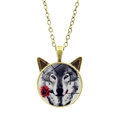 Detail of wolf and rose glass cabochon pendant with cat ear frame and bronze chain - Bronze