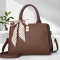 Detail of lychee pattern leather tote bag with silk scarf and gold twist lock closure - Coffee