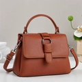 Brown lychee leather crossbody bag with silver buckle and adjustable strap - Earthy Yellow