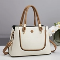 Detail of white lychee textured tote bag with brown straps and golden metal hardware - Off White