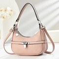 Detail of pink lychee leather hobo bag with silver lock and detachable strap - Pink