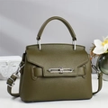 Detail of olive green lychee pattern leather handbag with silver twist lock and handle - Olive Green