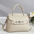 Beige lychee leather shoulder bag with silver metal buckle and adjustable strap - Apricot