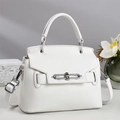 Detail of white lychee pattern leather bag with silver metal lock and curved handle - Off White