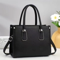 Bolso tote minimalista de cuero negro con asas dobles y correa de hombro ajustable - Negro