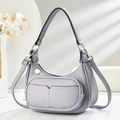 Detail of light purple pebbled leather half-moon bag with front zipper and silver hardware - Light Purple