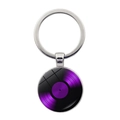 Macro detail of silver keychain with purple vinyl record art under glass dome - Purple Record Style