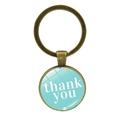 Gros plan d'un porte-clés bronze vintage avec cabochon 'thank you' bleu à pois - Pois Bleu Ciel (JY00500-8)