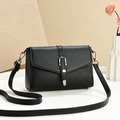 Elegant black lychee leather crossbody bag with silver hardware on a neutral background - Black