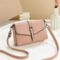 Pink lychee texture crossbody bag with metal buckle and adjustable shoulder strap - Pink