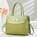 Detail of green crossbody bag with woven texture, smooth leather and gold metal clasp lock - Green