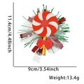 Christmas badge reel featuring a glitter candy cane design and festive bow decoration - Candy Style