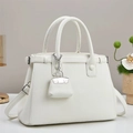 Elegant white lychee grain leather handbag with top handles and a mini charm pendant - Off White