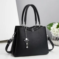 Black litchi grain leather tote bag with silver floral plaque and adjustable strap - Black
