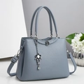 Fashionable blue large capacity crossbody handbag with lychee texture and flower pendant - Blue