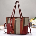 Detail of striped canvas tote with burgundy leather trim and matching small charm bag - Burgundy
