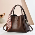 Dark brown leather bucket bag with silk scarf and top handles for elegant women - Coffee