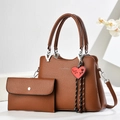 Brown litchi grain handbag and wallet set with an elegant heart pendant detail - Tote Bag And Wallet / Earthy Yellow