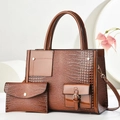 Detail of a brown crocodile pattern faux leather handbag and matching small wallet set - Tote And Wallet Set / Earthy Yellow