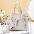 Detail of off-white lychee grain tote bag set with mini pouch and adjustable strap - Off White