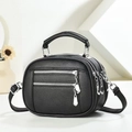 Black pebbled leather crossbody bag with wide shoulder strap and embroidered details - Black