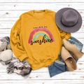 Flat lay of mustard yellow sweatshirt with You Are My Sunshine print and autumn accessories - S / Ginger Yellow (Black Text)