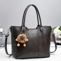 Chic dark brown faux leather tote bag with plush lion charm and adjustable shoulder strap - Gray