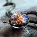 Close-up of galaxy nebula glass sphere pendant with antique bronze chain on wood - Mystic Colorful Nebula Style (JY001624-6)
