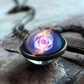 Macro shot of galaxy nebula glass ball pendant with bronze alloy base on wood - Cat's Eye Nebula Style (JY001624-7)
