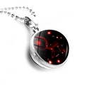 Close-up of Cancer zodiac necklace with double-sided glass sphere and silver ball chain - Silver-Cancer