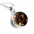 Macro shot of Leo zodiac star chart inside a double-sided glass ball pendant with bead chain - Silver-Leo