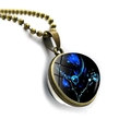 Detail of bronze Pisces zodiac pendant with blue double-sided glass orb and beaded chain - Bronze-Pisces