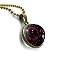 Close-up of Scorpius double-sided glass ball pendant with bronze alloy chain and starry sky - Bronze-Scorpio