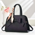 Detail of black pebbled leather handbag with large bow and fashion printed scarf handle - Bowknot Decor Style (917-28) / Black