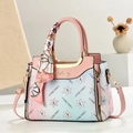 Pink and blue gradient floral handbag with silk-wrapped handle and golden logo - Pink