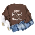 Flat lay of brown grandma sweatshirt with blue jeans and white high-top canvas shoes - S / Coffee