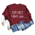 Flat lay of maroon crew neck sweatshirt featuring Fun Fact I Don't Care lettering - Wine Red (White Font)