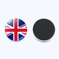 Detail of round Union Jack glass fridge magnet showing the front design and magnetic back - United Kingdom