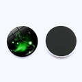 Detail view showing Aries zodiac glass dome magnet with a green aurora star pattern - Aries