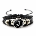 Detail of multi-layer leather bracelet with letter J glass cabochon and silver beads - Letter J