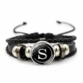 Detail view of multi-layer black leather bracelet with letter S glass pendant charm - Letter S