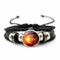 Macro detail of hand-woven leather bracelet featuring a galaxy glass cosmic dome charm - Starry Sky Explosion (JY002075-9)