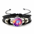 Macro view of woven leather bracelet featuring a cosmic nebula glass cabochon - Blue Orange Purple Galaxy (JY002075-10)