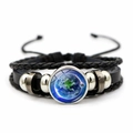 Detail of layered braided leather bracelet featuring a glass dome with Earth pattern charm - Earth Pattern (JY002075-12)