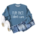 Detail of blue crewneck sweatshirt with white 'Fun Fact: I don't care' text print - Blue (White Font)