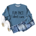 Flat lay of blue sweatshirt with 'FUN FACT: I don't care' text and casual denim styling - Blue (Black Font)