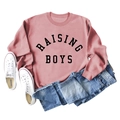 Flat lay of pink sweatshirt with RAISING BOYS text and ribbed cuffs on white background - S / Rose Gold