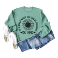 Detail of mint green sweatshirt with sunflower print and Be Kind inspirational text - Light Green Sweatshirt (Black Text Pattern)