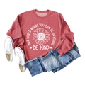 Flat lay of red sunflower sweatshirt with Be Kind slogan paired with jeans and shoes - Red Sweatshirt (White Text Pattern)